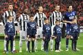 Juventus players with small boys listen anthem