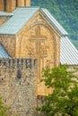 Jvari Monastery - sixth-century Georgian UNESCO World Heritage site- Closeup of carved cross on one tower with ancient castle like