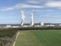 JÃ¤nschwalde power plant in Brandenburg photographed from the lookout tower in Teichland Large cooling towers with steam for the