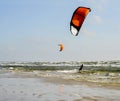 JÃÂ¼rmala Latvia. Surfing at the sea with a red parachute at s