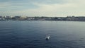 4k aerial of tourists fishing in blue seas from a speed boat