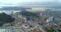 Aerial view over city and park with Bai Tho karst mountain Ha long bay. Halong City, Vietnam