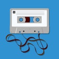 The vintage symbol of an audio cassette with the tape unwound. Royalty Free Stock Photo