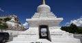 4k busy traffic & pedestrian through white stupa in Lhasa,Tibet.