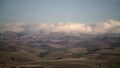 8K Cloud Flowing Down Ridge Of Mountain