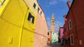 4K. Colorful houses in Burano island, Venice. The leaning tower of San Martino.