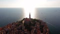 4K. Flight over beautiful Rovinj at sunset. Evening aerial view of the old town of Rovinj and Church of St. Euphemia, Croatia.