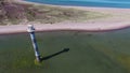 4K. Flight over old lighthouse standing in the sea, aerial view. Estonia, Saaremaa island