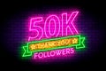 50K, 50000 followers neon sign on the wall. Royalty Free Stock Photo