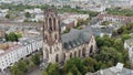 4k footage of a drone panning out to reveal the surrounding area around the Great Saint Martin Church in Cologne, Germany.