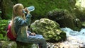 4K Girl Drinking Water by a River, Child Portrait Near a Brook in Mountains