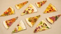 4k Grop of triangular slices of different types of pizza pull together and spread to the center on a beige kraft paper background.