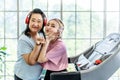 Happy Asian daughter and elderly mother in sportswear exercise together at home both of them smiled happily. Retired woman Royalty Free Stock Photo