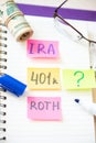 401k ira roth on pieces of colorful paper dollars on table. Pension concept. Retirement plans Royalty Free Stock Photo