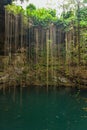 Ik-Kil Cenote, Mexico. Lovely cenote in Yucatan with transparent waters and hanging roots. Chichen Itza, Central America.