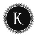 K letter in circle frame in floral ornament style on black color and white background