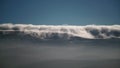 8K Mist Cloud Flowing Down Ridge of Mountain Range