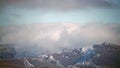 8K Mist Cloud Flowing Down Ridge of Mountain Range