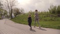 4K Mother and daughter running joggin outdoor in the park