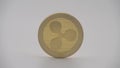 4K Physical metal golden Ripplecoin currency on white background. XRP coin-Dan