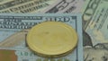 4K Physical metal golden Ripplecoin currency over diferents dollars bills