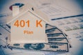 401 k Plan text on house with money and chart Royalty Free Stock Photo