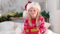 4k Portrait little girl with Christmas gift box Fulfilling children new year wishes, dreams and surprises