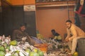 K.R.Market, Bangalore, India - February 06,2021: Hindu and Muslim pineapple sellers showing victory symbol