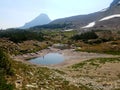 4k Rocky Mountain high forest glacier lake in the summer Royalty Free Stock Photo