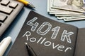 401k rollover memo on the notepad and cash. Royalty Free Stock Photo