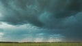 4K Sky During Rain Horizon Above Rural Wheat Landscape Field. Agricultural And Weather Forecast Concept. Storm, Thunder