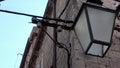 4K. Streetlight or lamp hanging on the facade of a building in Dubrovnik.