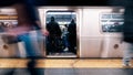 4K UHD Time-lapse of unidentified people waiting and boarding train at Times Square subway station platform in New York city