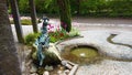 4K video of fountain in the shape of a rooster in the botanical garden.