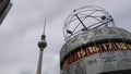 4K. The World Clock and the Television Tower at Alexanderplatz in Berlin