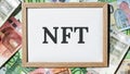 4k zoom in out NFT non-fungible token text. Concept words NFT non-fungible token on paper blank. Background of euro