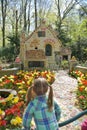 KAATSHEUVEL, NETHERLANDS - APRIL 19, 2019: Girl looks at the house of the Little Red Riding Hood in Efteling Park in the Holland