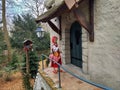 Kaatsheuvel / The Netherlands - March 29 2018: Little Red Hood near the door of a house in Theme Park Efteling