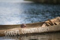 Children in a dugout canoe on Lake Bunyonyi