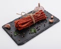 Kabanos delicious polish snack sausage on a stone plate white background