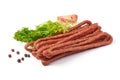 Kabanos. Polish long thin dry sausage made of pork. Isolated on white background Royalty Free Stock Photo
