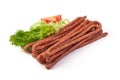 Kabanos. Polish long thin dry sausage made of pork. Isolated on white background Royalty Free Stock Photo