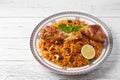 Kabsa at white wooden background. Kabsa is traditional saudi arabian cuisine dish