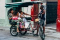 A kabuki taxi drops a family off at their destination in Havana, Cuba. Royalty Free Stock Photo