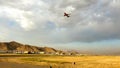 Boeing 737 passenger aircraft departing from Hamid Karzai International Airport in Kabul during sunset.