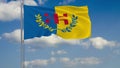 Kabylia flag against background of clouds floating on the blue sky