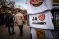 KACAREVO, SERBIA - FEBRUARY 18, 2023: Crowd of people in an alley of Slaninijada passing by a tshirt saying Ja volim slaninu