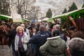 KACAREVO, SERBIA - FEBRUARY 18, 2023: Crowd of people in a packed alley of the Kobasicijada, a traditional market of cured meat