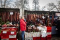 KACAREVO, SERBIA - FEBRUARY 18, 2023: Stand of a butcher in the Slaninijada Kacarevo market selling sausages, smoked and cured