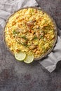 Kacchi Mutton Biryani is a delicious rice dish where tender lamb meat pieces are marinated with lots of spicy closeup on the plate